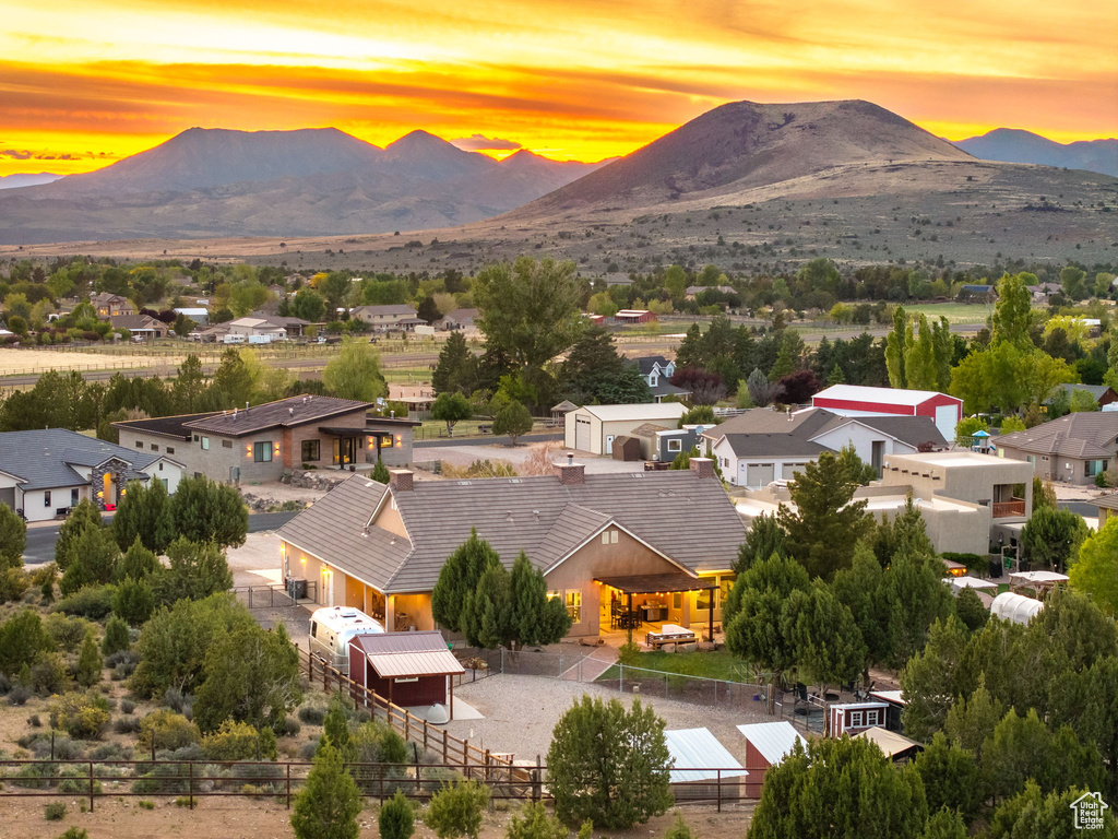Aerial view at dusk with a residential view and a mountain view