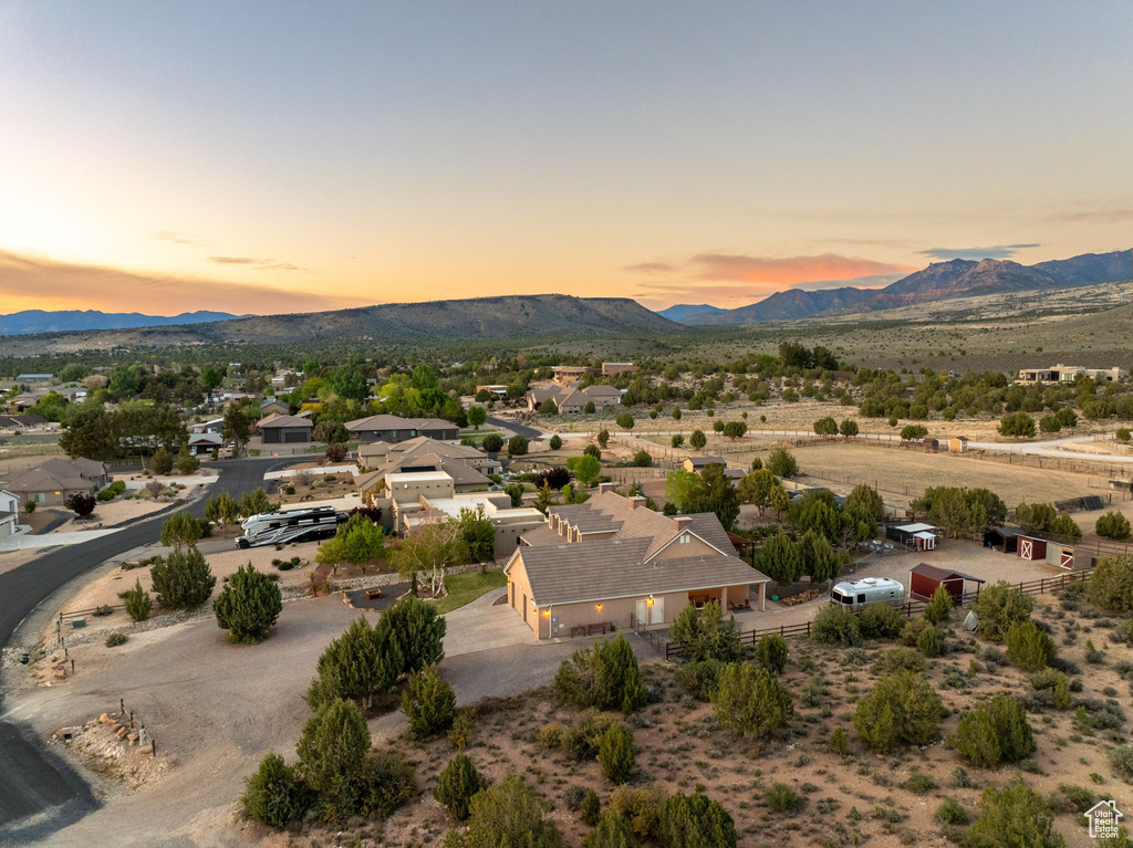 Aerial view at dusk featuring a mountain view