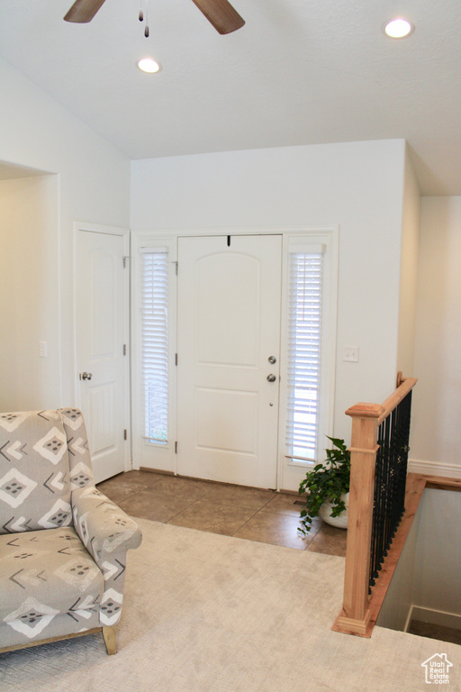 Foyer with a ceiling fan and recessed lighting