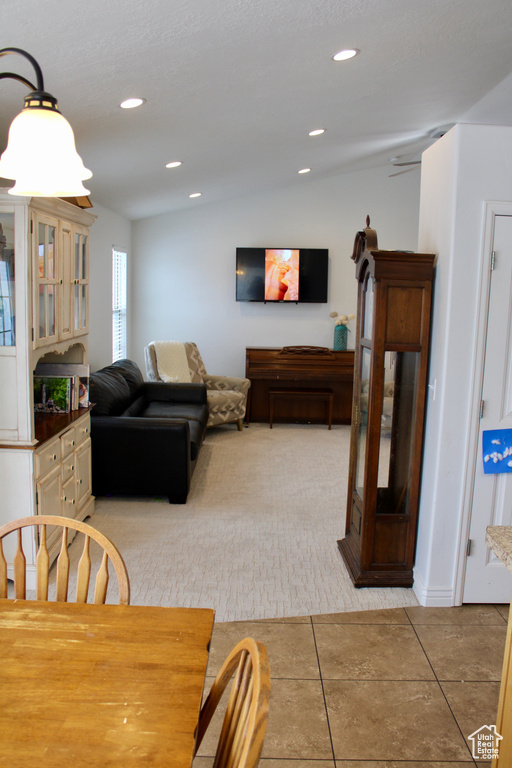 Dining space featuring recessed lighting and light tile patterned floors