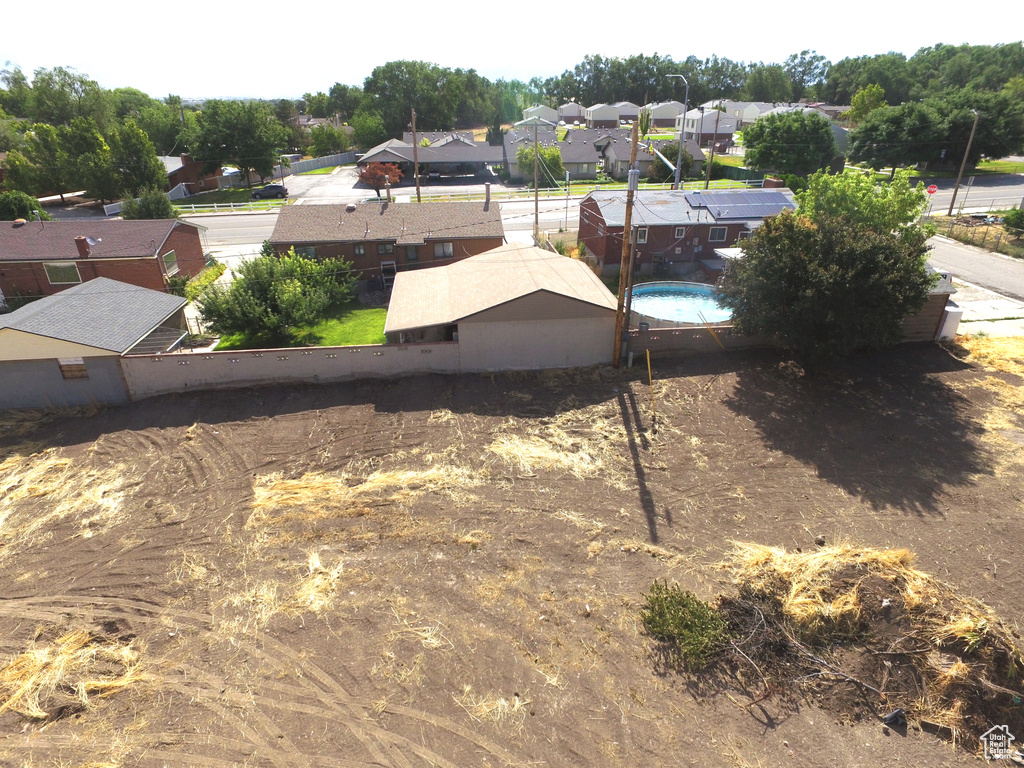 View of yard with fence and a residential view