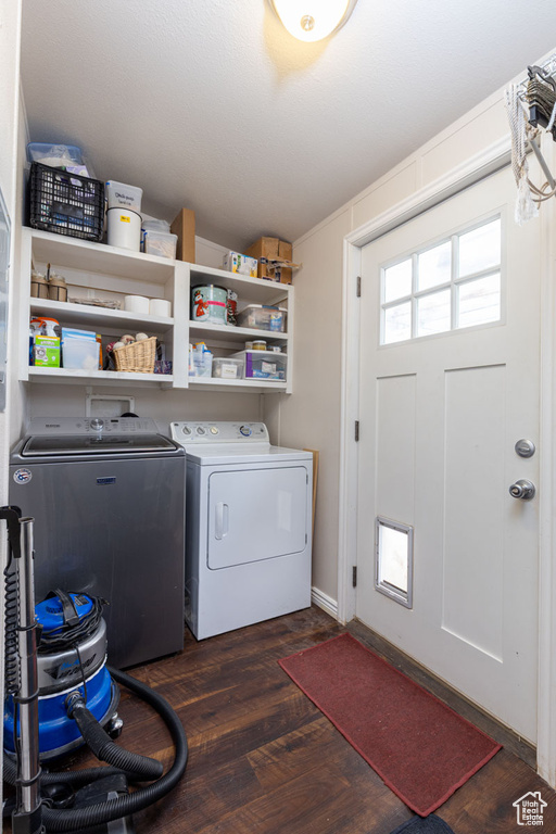 Laundry area featuring laundry area, separate washer and dryer, and dark wood-style floors