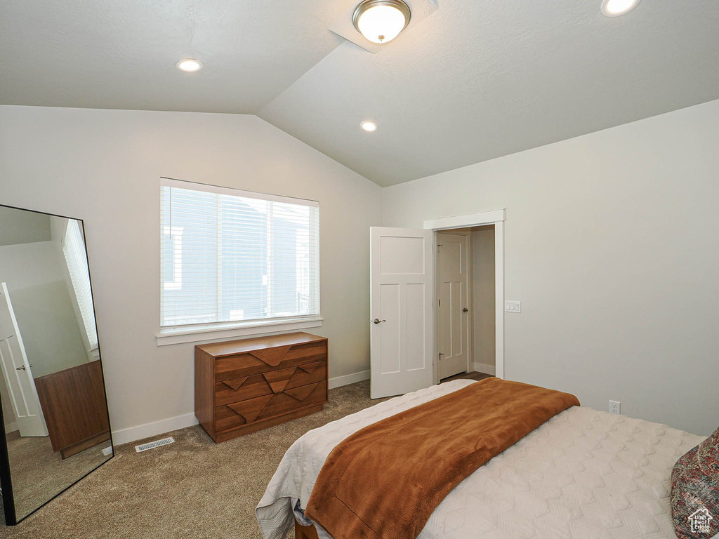 Bedroom featuring carpet floors, visible vents, baseboards, recessed lighting, and vaulted ceiling