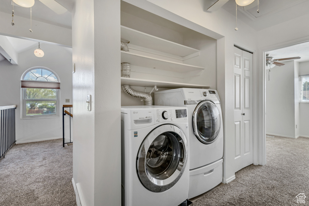 Laundry room featuring ceiling fan, laundry area, washing machine and clothes dryer, baseboards, and carpet flooring