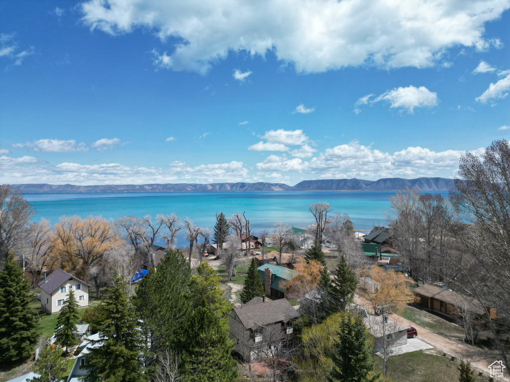 Drone / aerial view with a water and mountain view