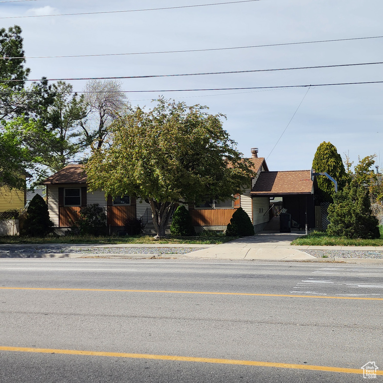 Obstructed view of property featuring concrete driveway
