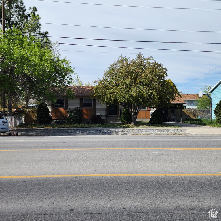 View of front of property featuring fence