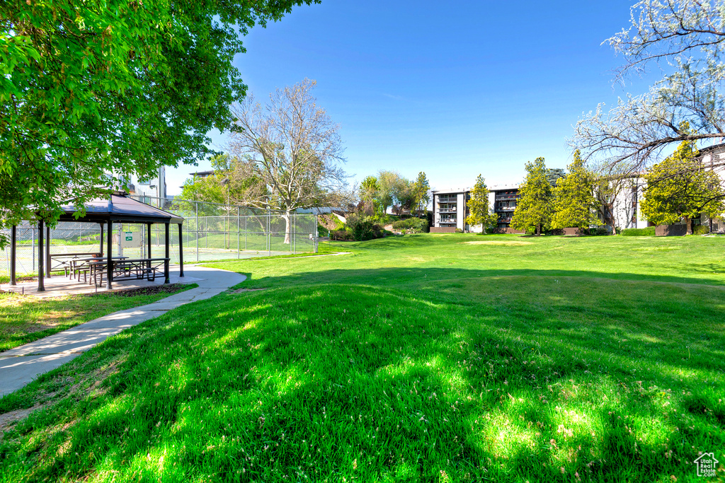 View of yard featuring a gazebo and fence