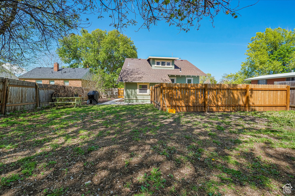 View of yard with a fenced backyard