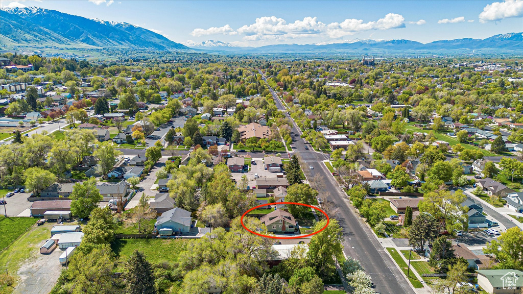 Birds eye view of property with a residential view and a mountain view