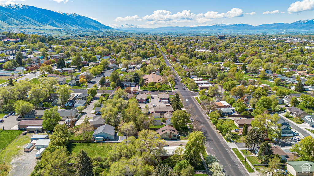 Birds eye view of property with a mountain view and a residential view