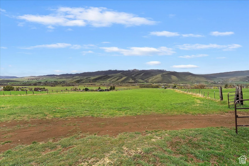 Property view of mountains with a rural view