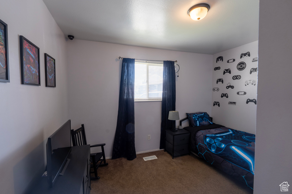 Bedroom featuring carpet floors and visible vents