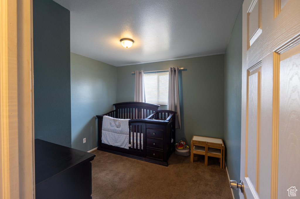 Carpeted bedroom with baseboards
