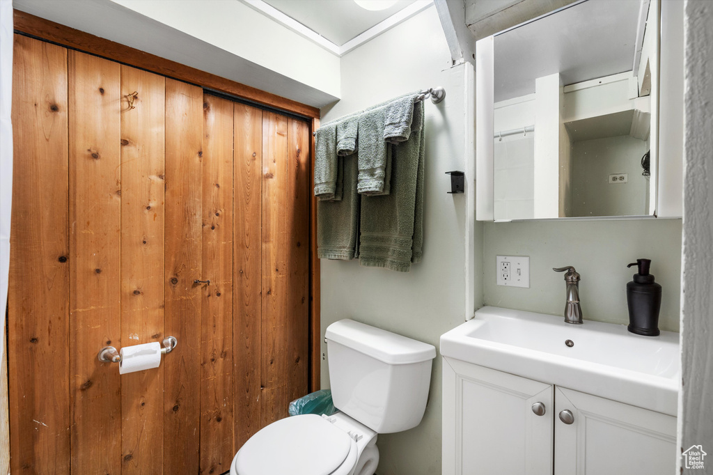 Bathroom featuring vanity and toilet