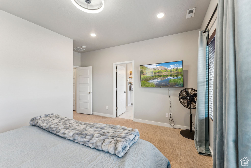 Carpeted bedroom with recessed lighting, baseboards, and visible vents