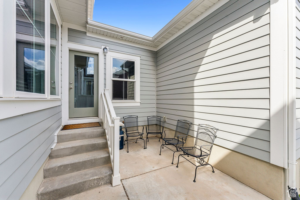 Property entrance with a patio area