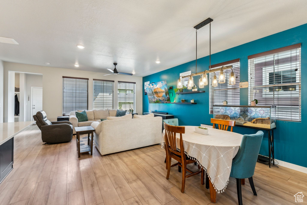 Dining space with recessed lighting, a ceiling fan, light wood-style flooring, and baseboards