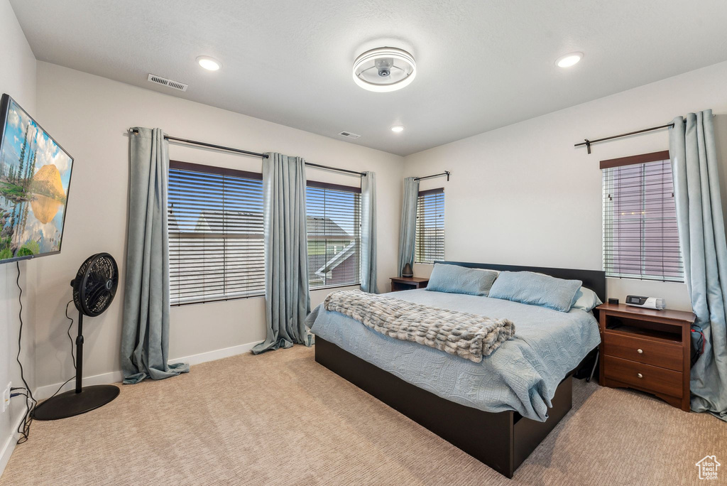 Bedroom with visible vents, recessed lighting, carpet, and baseboards