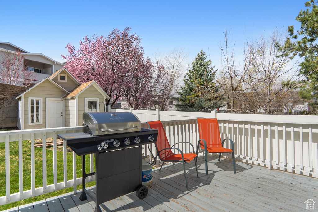 Deck with fence and a grill