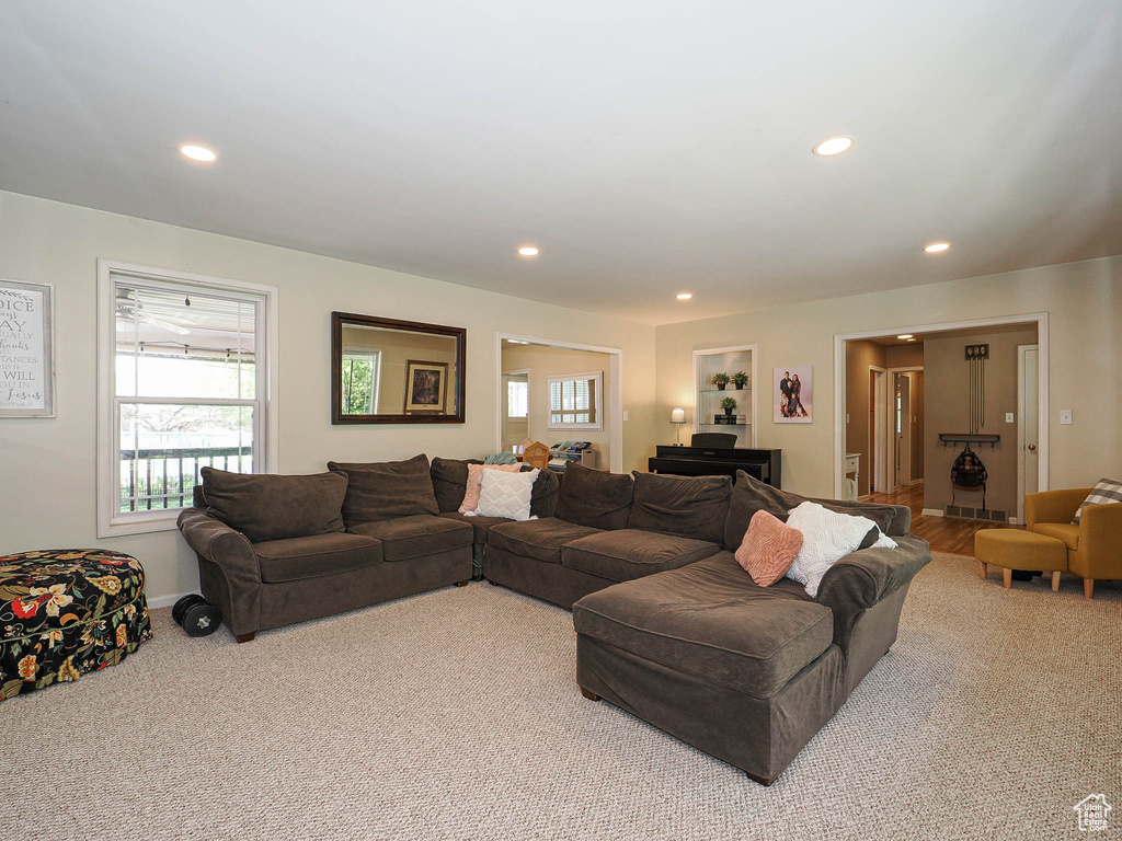Living area featuring carpet and recessed lighting