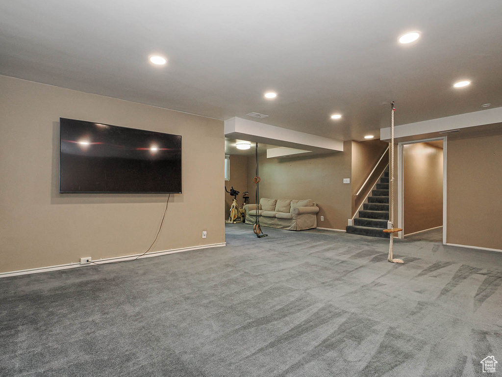 Finished basement with stairway, baseboards, carpet, and recessed lighting