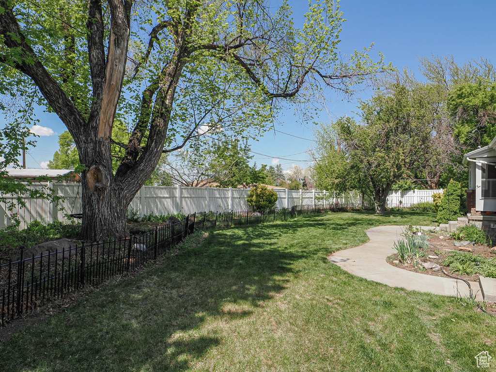 View of yard with a fenced backyard