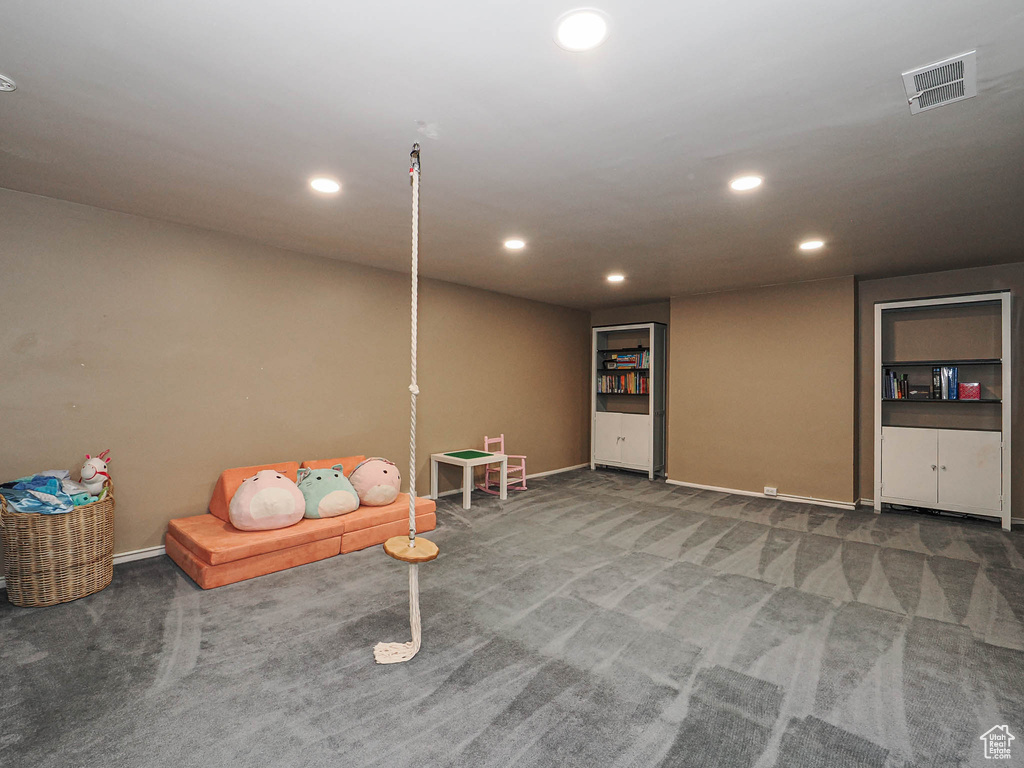 Recreation room with carpet floors, recessed lighting, baseboards, and visible vents
