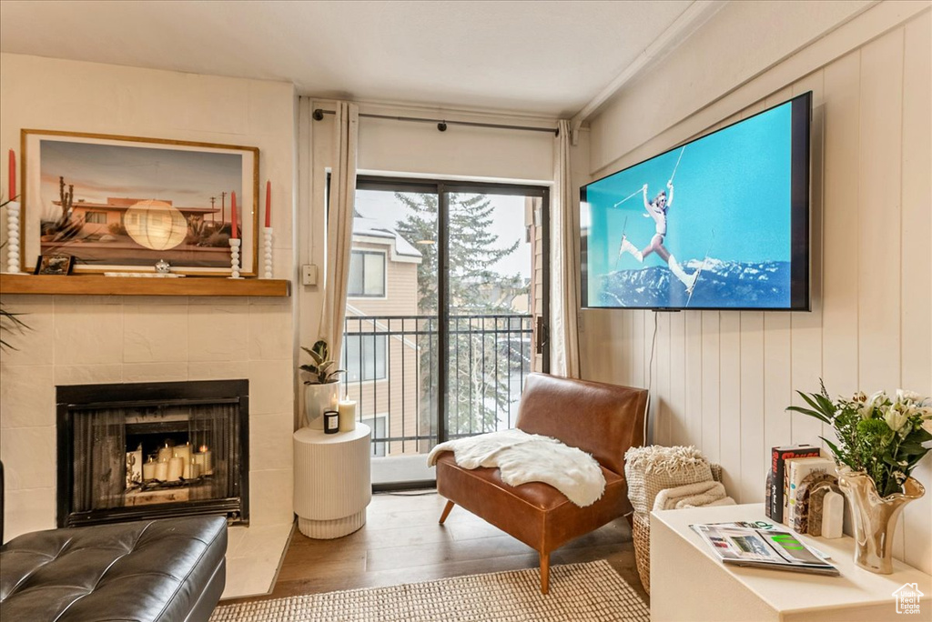 Living area featuring wood finished floors and a fireplace
