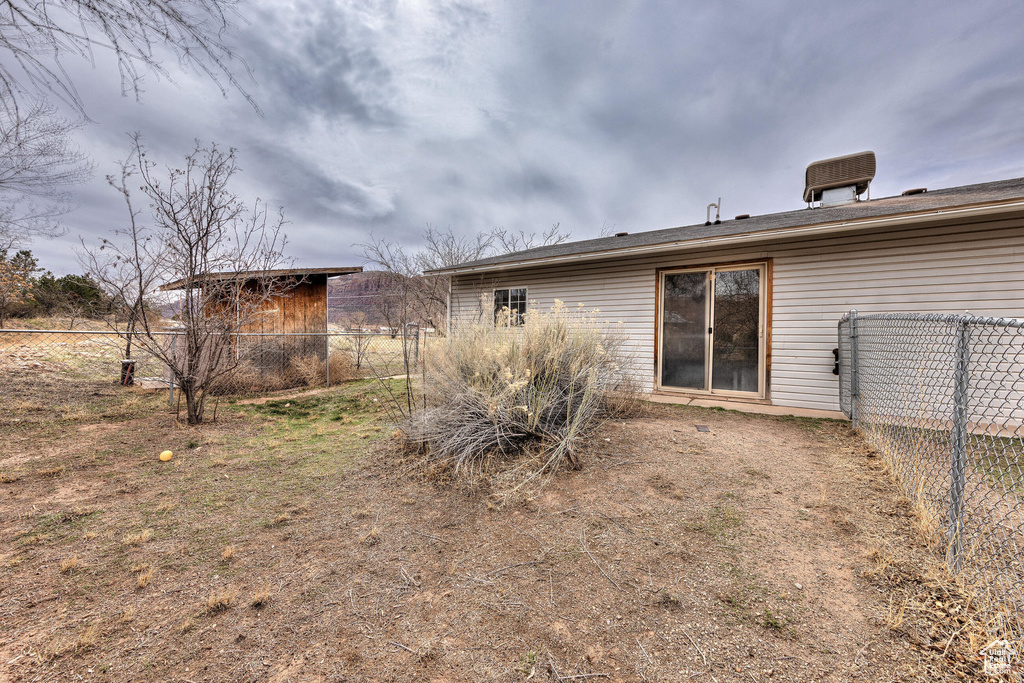 Back of property with fence