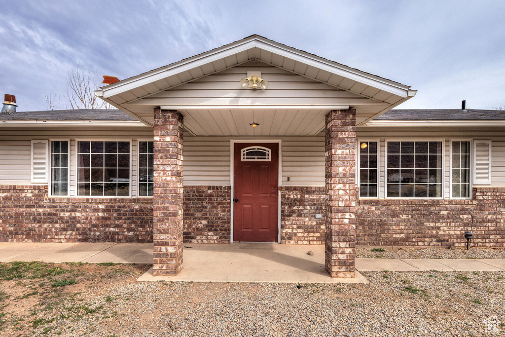 View of front of house with brick siding