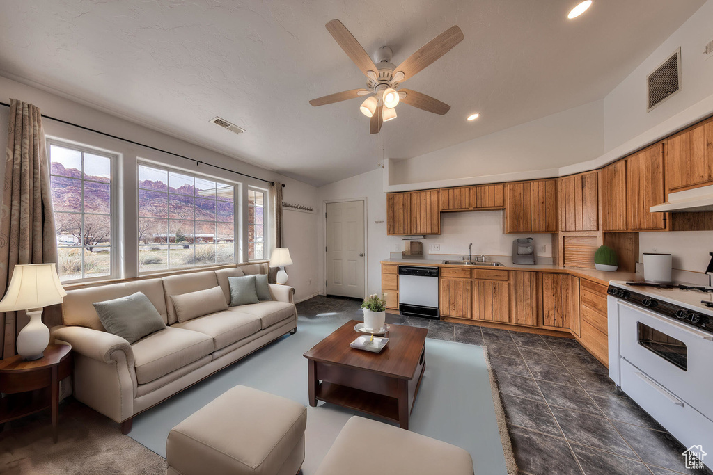Living area with recessed lighting, visible vents, ceiling fan, and vaulted ceiling