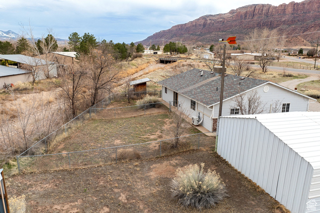 Birds eye view of property with a mountain view