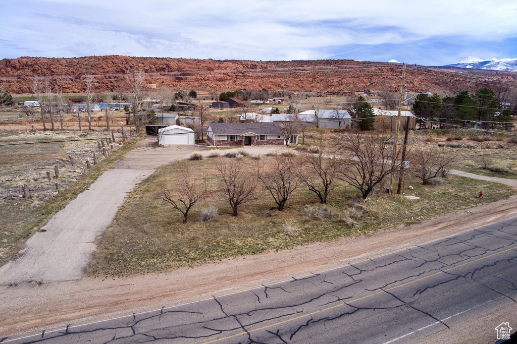Birds eye view of property with a mountain view