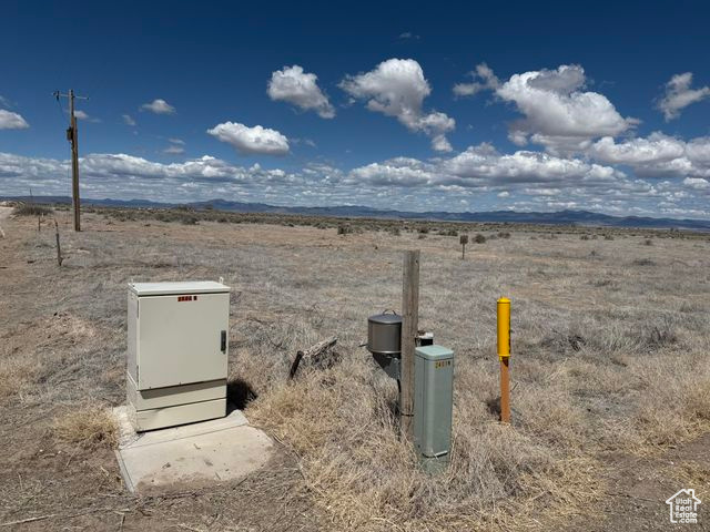 View of storm shelter with a rural view