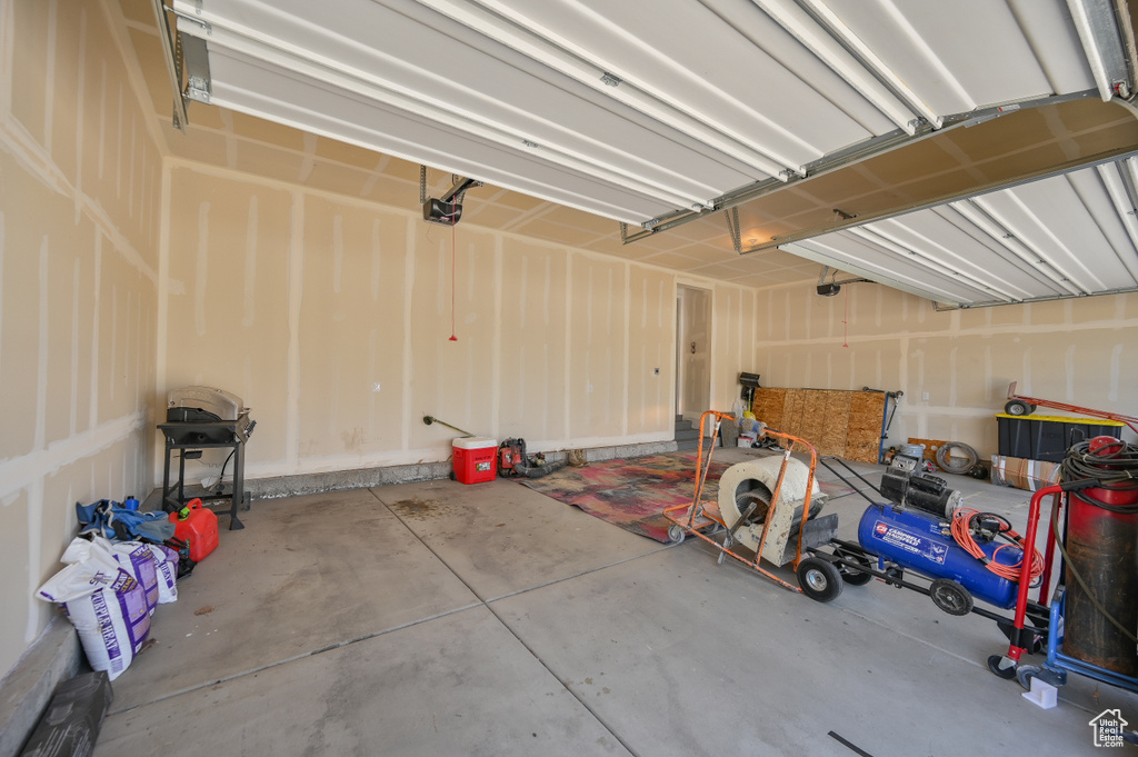 Garage featuring a garage door opener