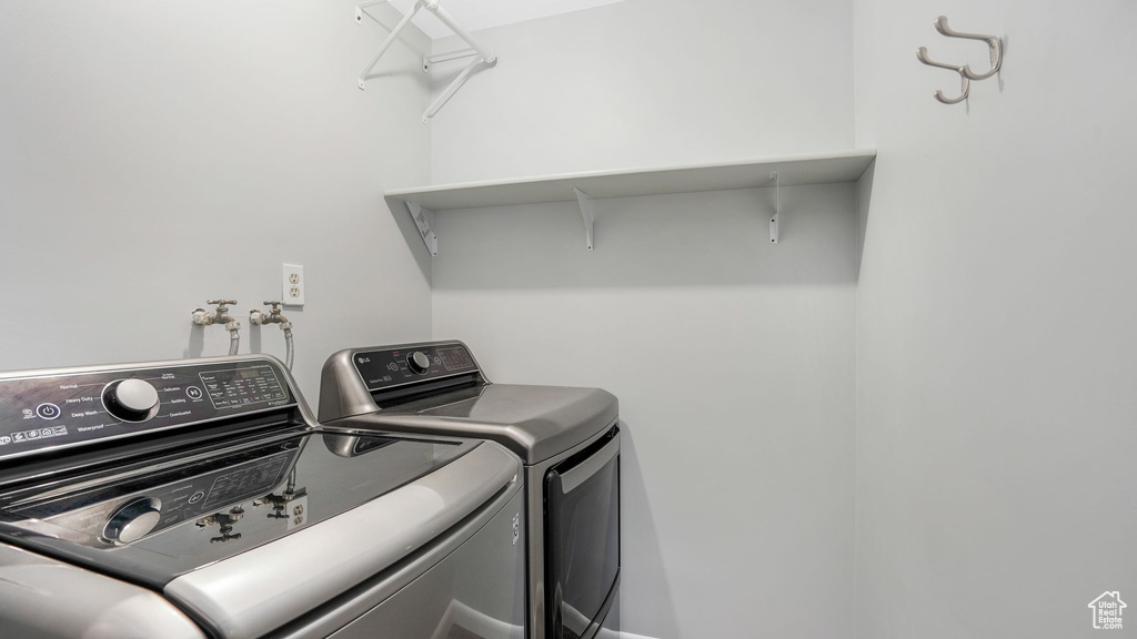 Laundry area with laundry area and washing machine and clothes dryer