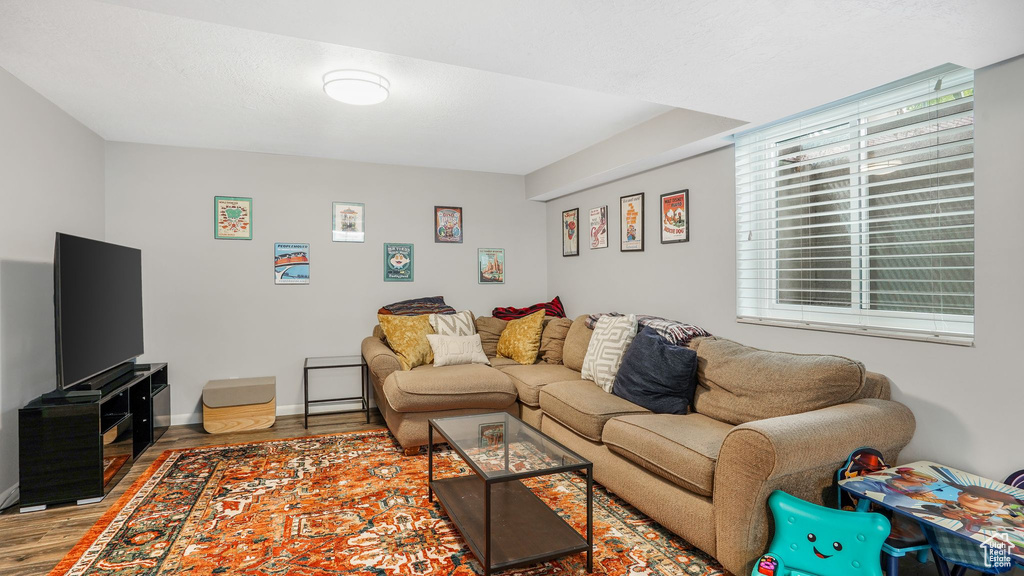 Living room with baseboards and wood finished floors