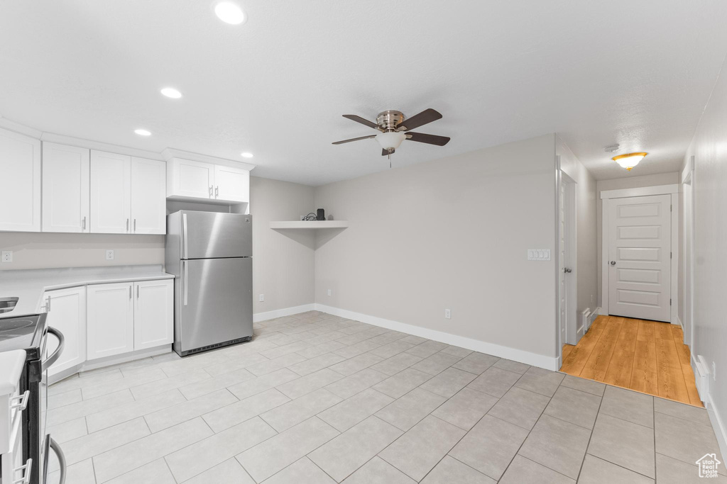 Kitchen featuring recessed lighting, light countertops, white cabinetry, a ceiling fan, and appliances with stainless steel finishes