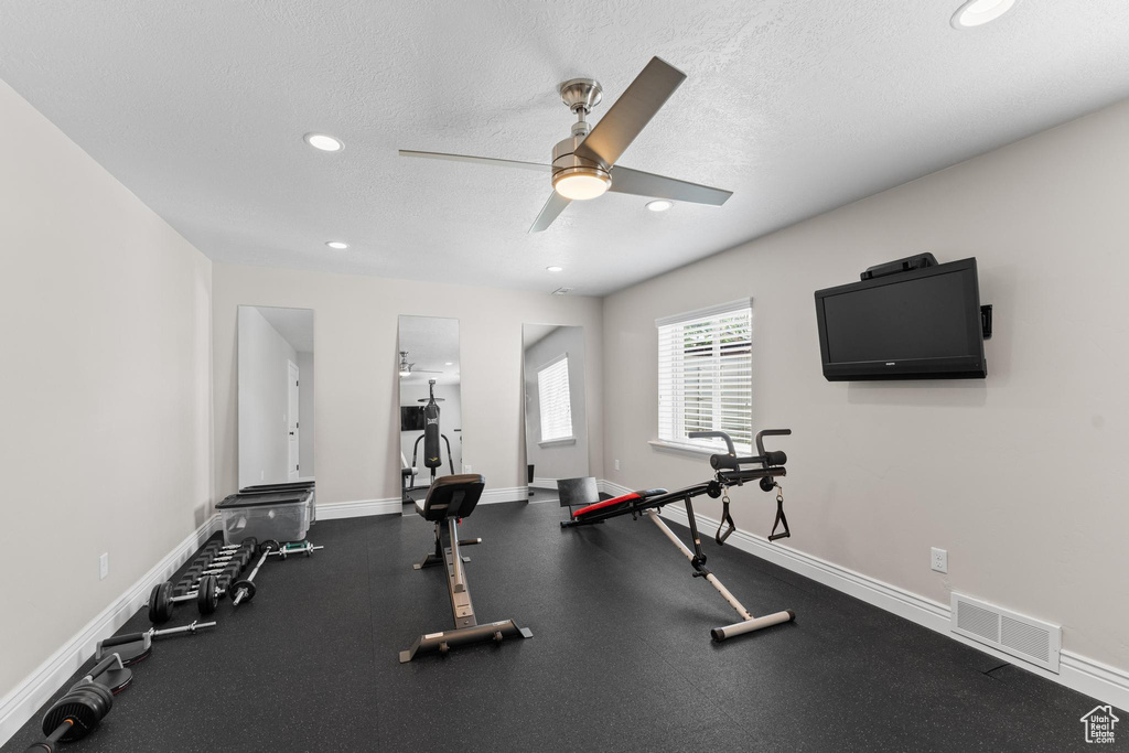 Workout area with a ceiling fan, a textured ceiling, visible vents, and recessed lighting