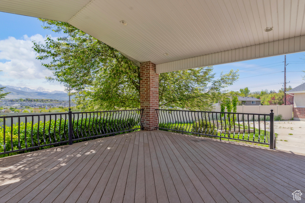 Wooden terrace featuring a mountain view
