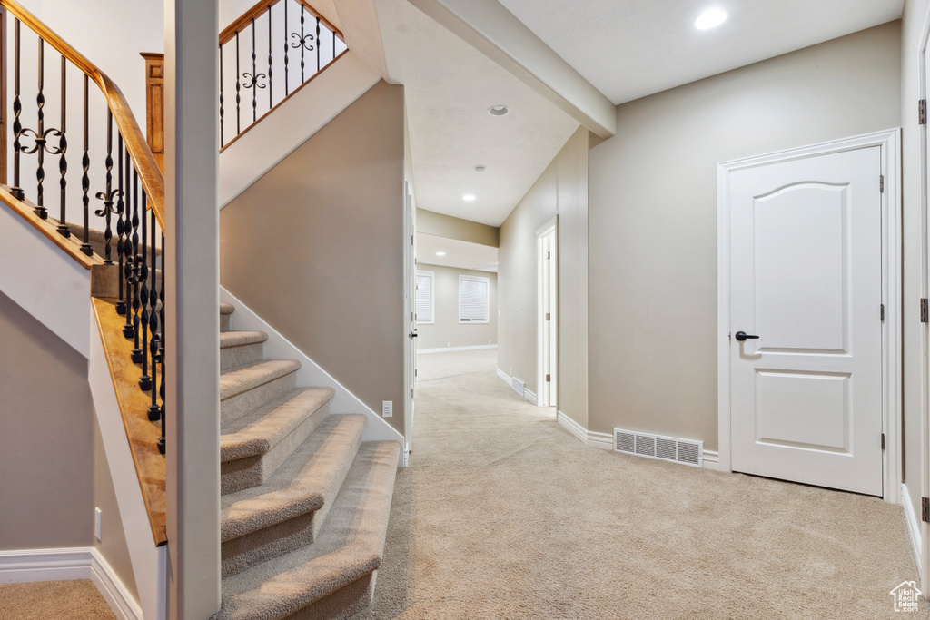 Stairs with baseboards, carpet, recessed lighting, and visible vents