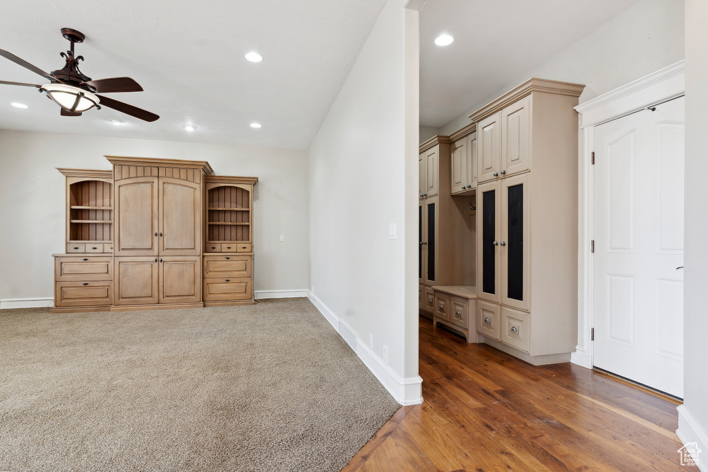 Unfurnished living room featuring baseboards, ceiling fan, recessed lighting, and wood finished floors