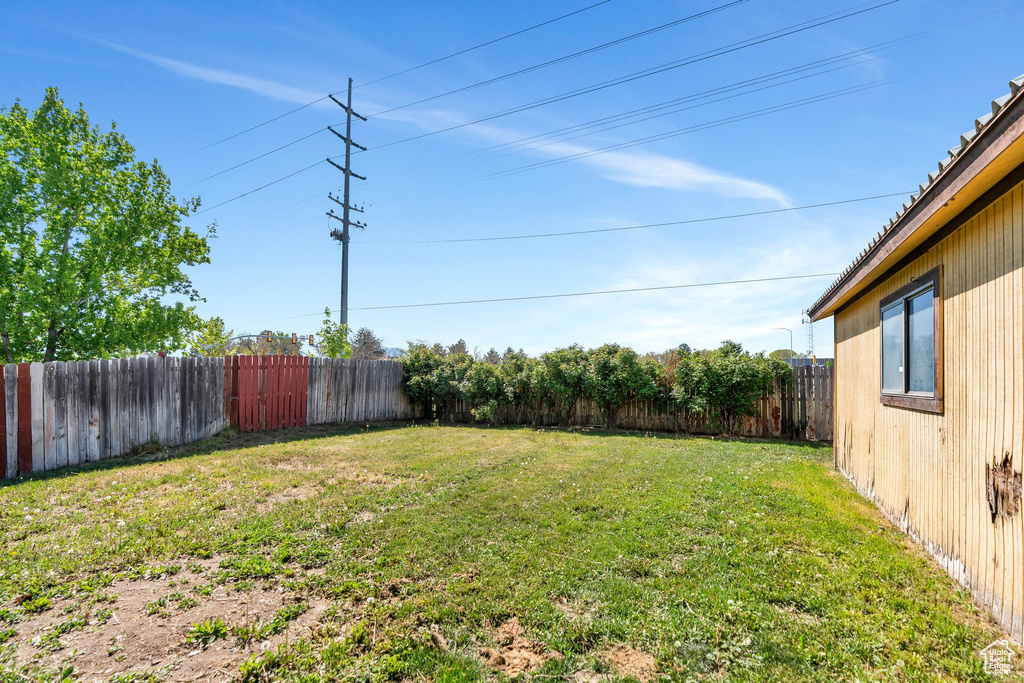 View of yard featuring a fenced backyard