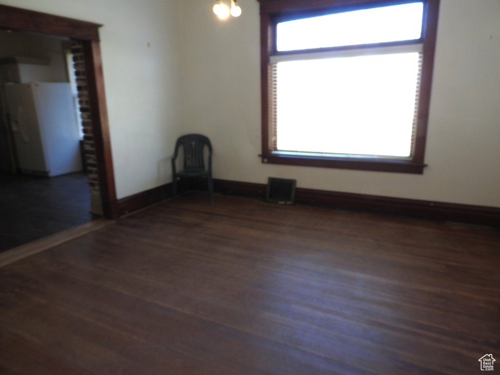 Empty room featuring wood finished floors
