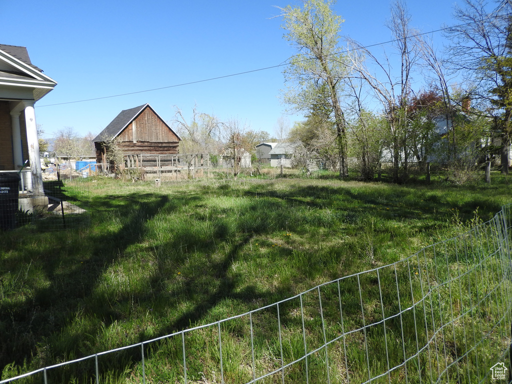 View of yard featuring fence