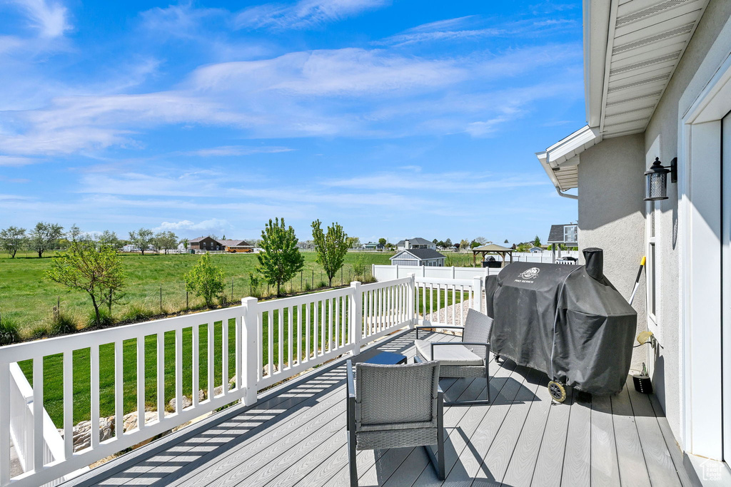 Deck featuring a lawn and area for grilling
