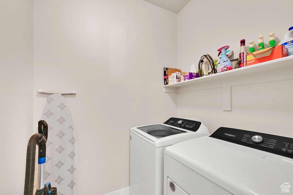Washroom with laundry area and washing machine and dryer