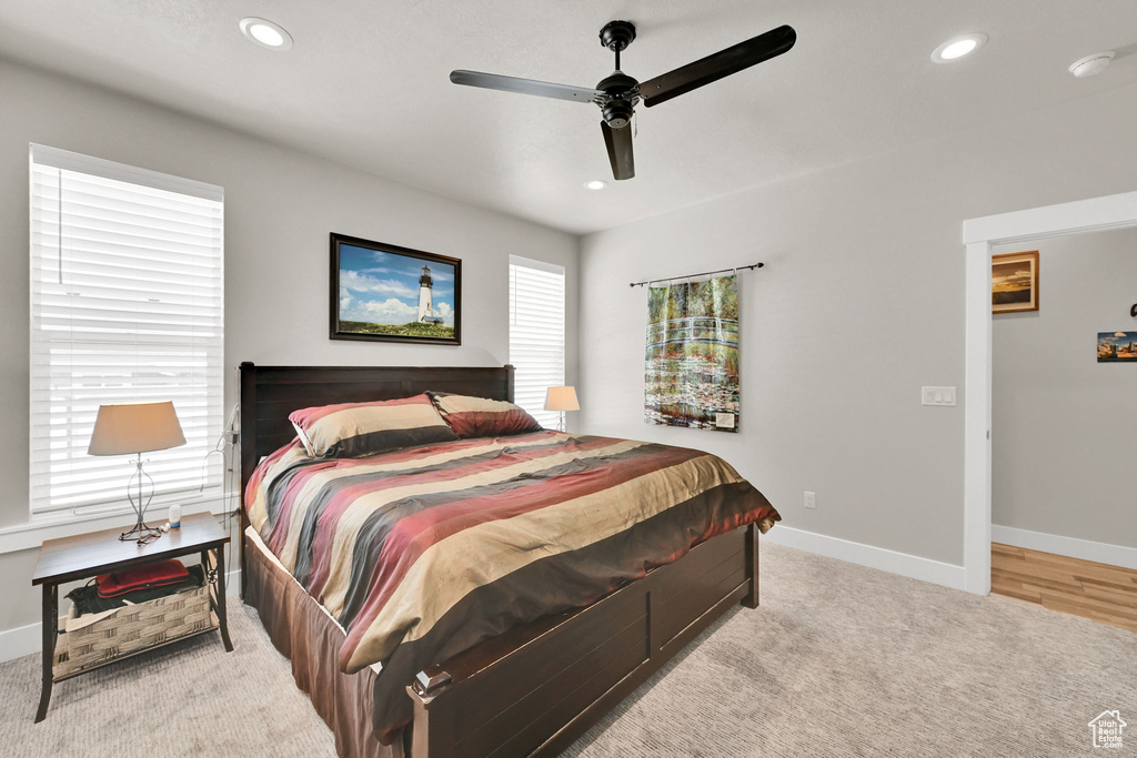 Carpeted bedroom with recessed lighting, baseboards, and ceiling fan