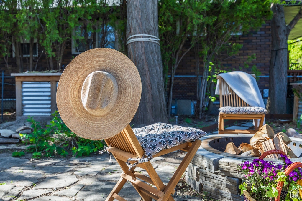 View of patio featuring an outdoor fire pit